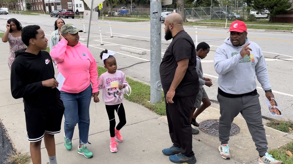 Family searching down Independence Ave.