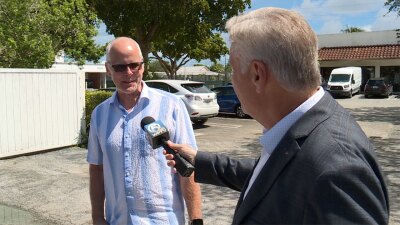 WPTV reporter Matt Sczesny talks to a resident about home insurance costs in Florida.