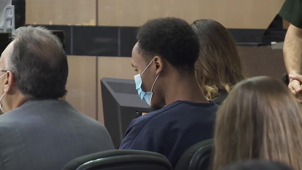 Travis Rudolph sits next to defense attorneys during 'stand your ground' hearing, Nov. 8, 2021