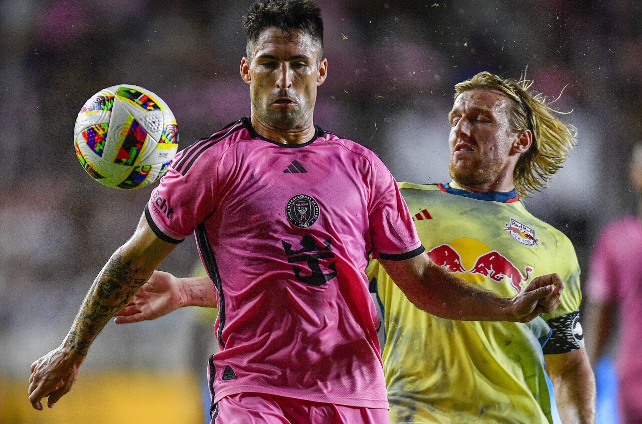 Inter Miami defender Franco Negri, left, protects the ball from New York Red Bulls midfielder Emil Forsberg during the second half of an MLS soccer game, Saturday, May 4, 2024, in Fort Lauderdale, Fla. (AP Photo/Michael Laughlin)
