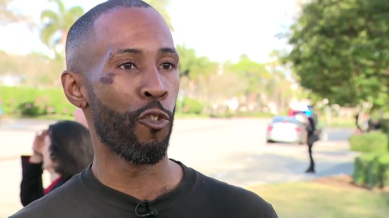 Kemen Fearon, who works at Cooper's Hawk at the Gardens Mall, assisted people. Feb. 14, 2024