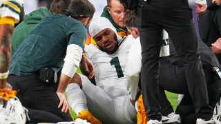 Green Bay Packers' Micah Parsons reacts after an injury during the second half of an NFL football game against the Denver Broncos Sunday, Dec. 14, 2025, in Denver, Co.
