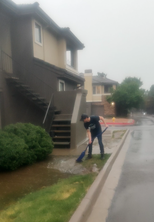 Ryan Trimble shoveling water