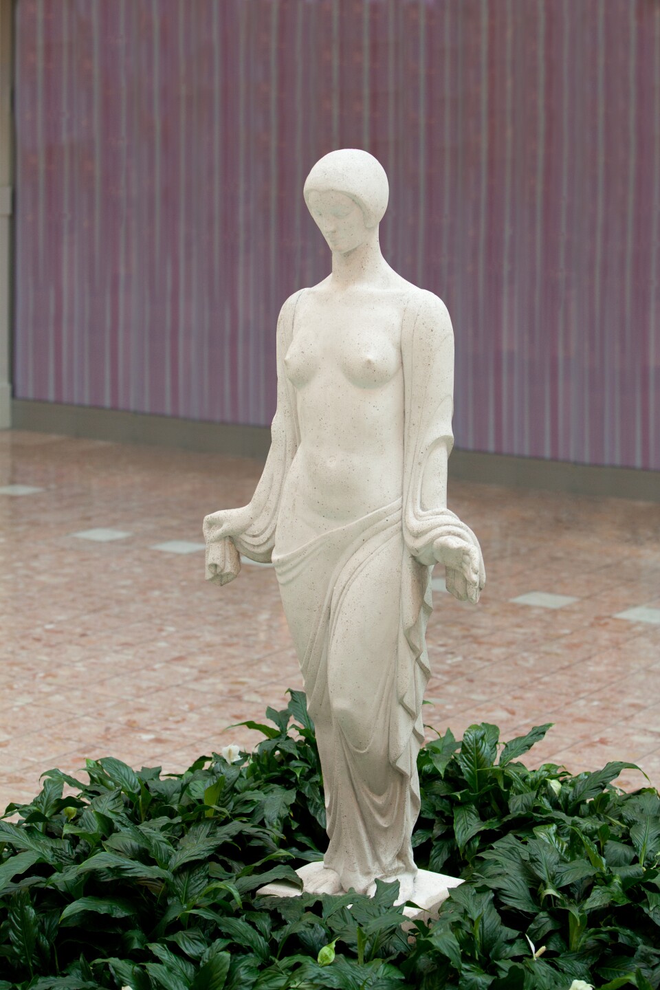 Maya by Wheeler Williams – a stone cast sculpture originally created for the artist’s garden, offering serenity through its grace and elegance.