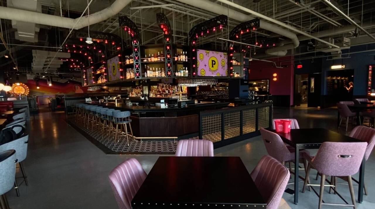 Views from the first floor of Puttshack; main bar dining area.