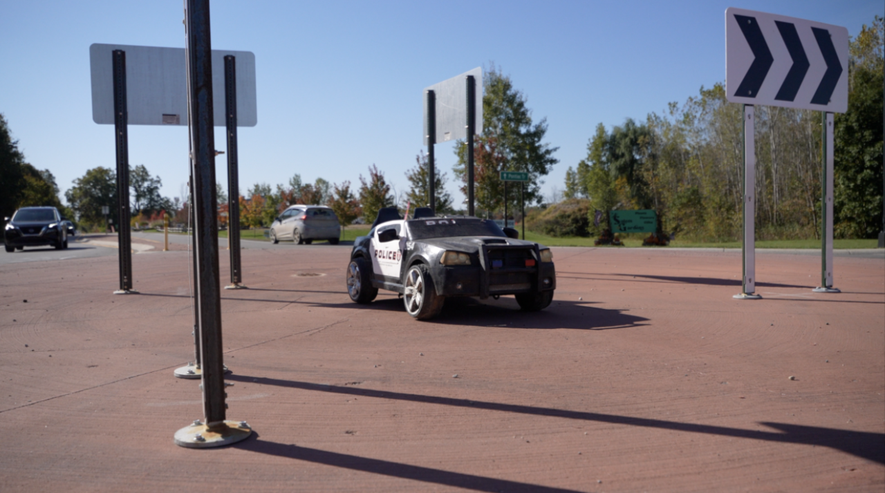 A toy police car in South Lyon is actually slowing down real drivers
