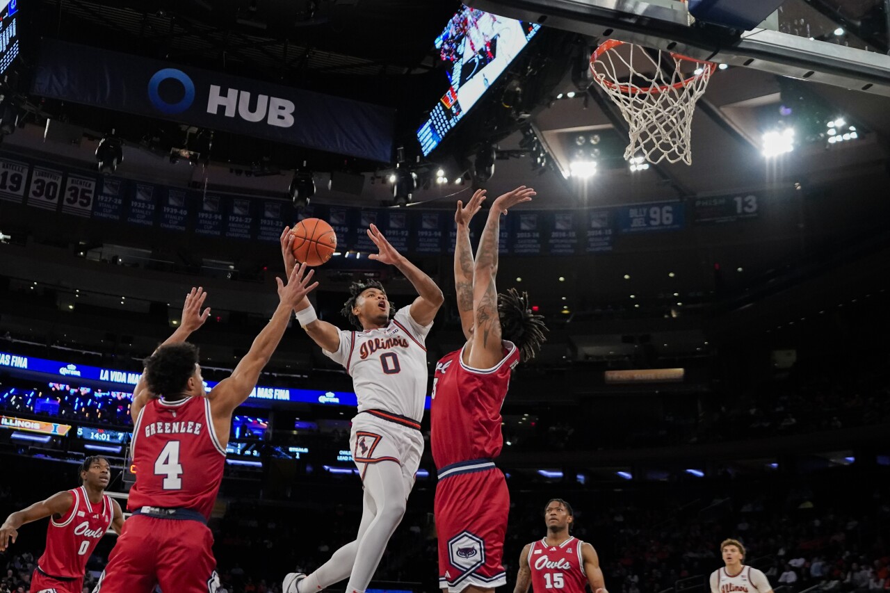 Illinois Fighting Illini guard Terrence Shannon Jr. shoots between Florida Atlantic Owls guard Bryan Greenlee and forward Giancarlo Rosado in Jimmy V Classic, Dec. 5, 2023