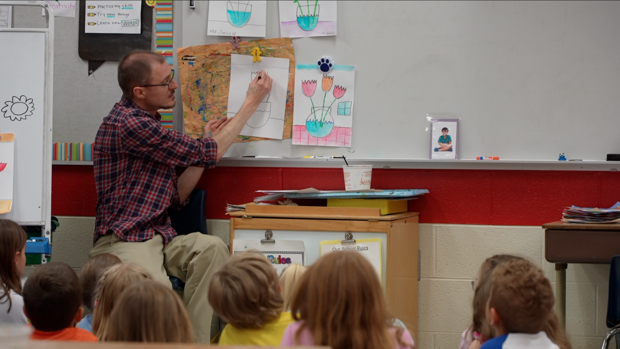 Bob Jaruzel teaching one of many art classes at Schavey Road Elementary