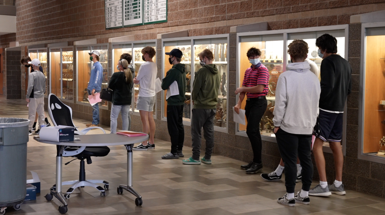 Students line up at Williamston High School to get tested for COVID-19