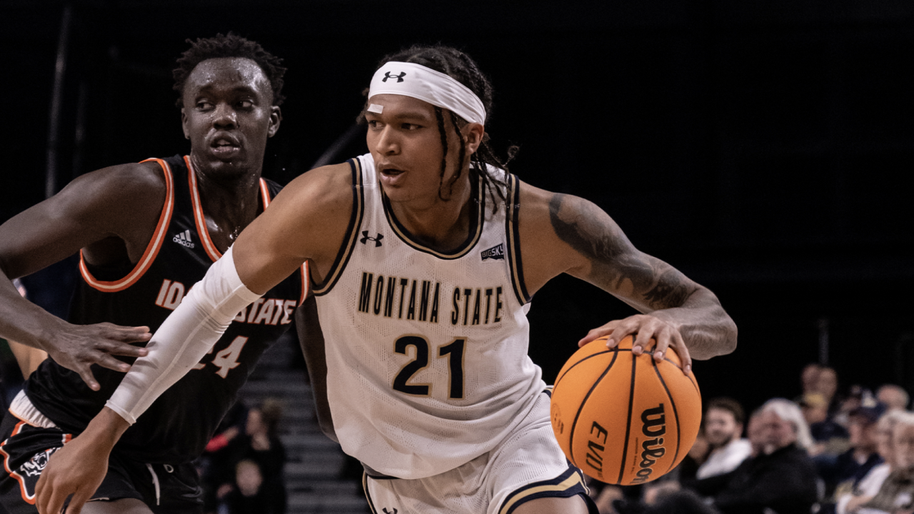 RaeQuan Battle drives past Idaho State's Ed Chang.