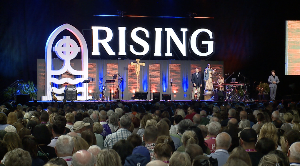 Speakers on stage for Rising from the Ashes Revival at Huntington Place