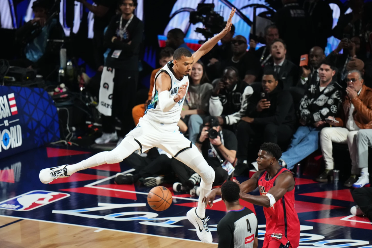 World center Victor Wembanyama, of France, defends on USA Stars guard Anthony Edwards during the NBA All-Star basketball game Sunday, Feb. 15, 2026, in Inglewood, Calif.
