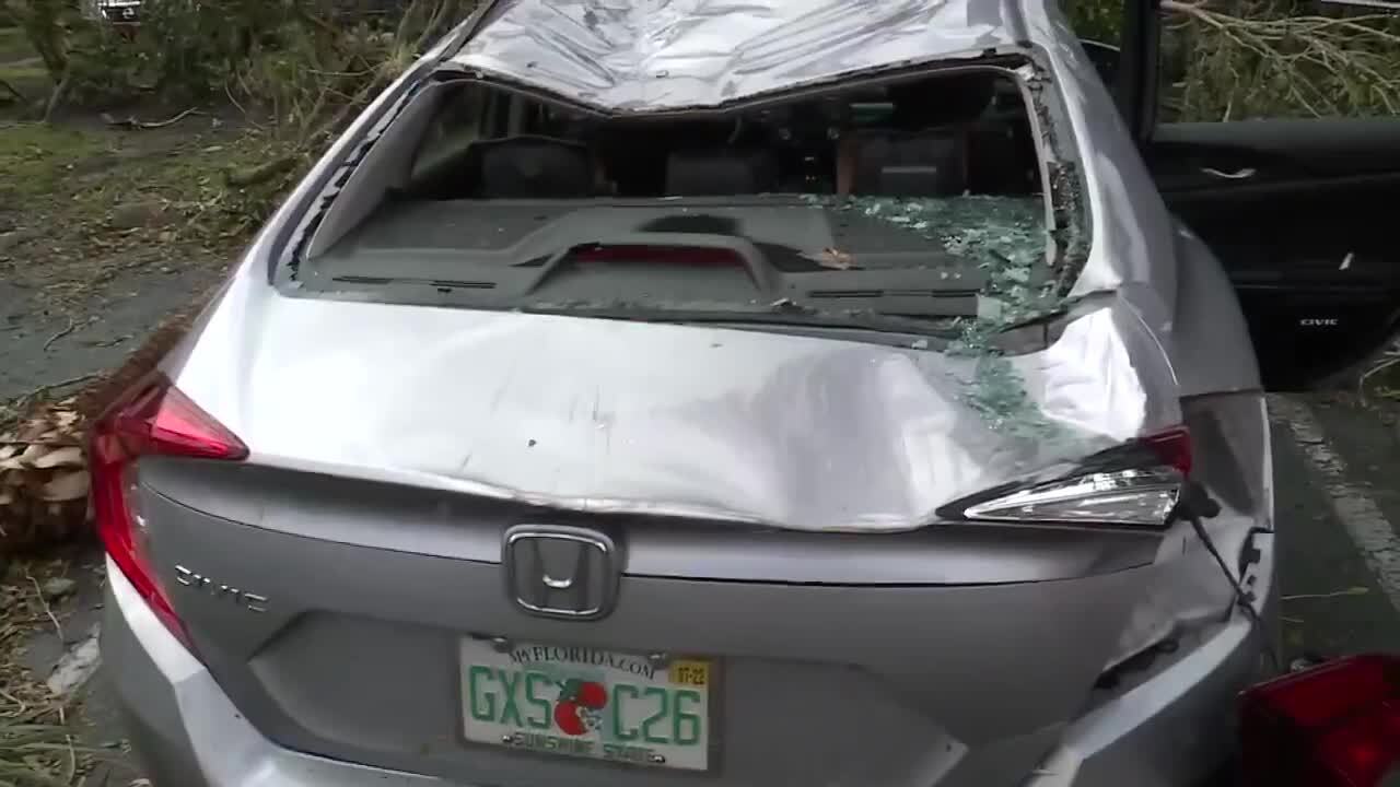 car with child's car seat in back damaged during North Palm Beach tornado, April 30, 2023