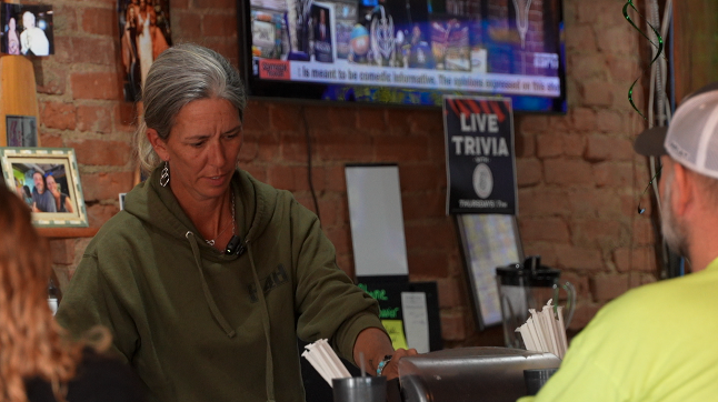 Rebecca Light serving customers at the Green Kayak