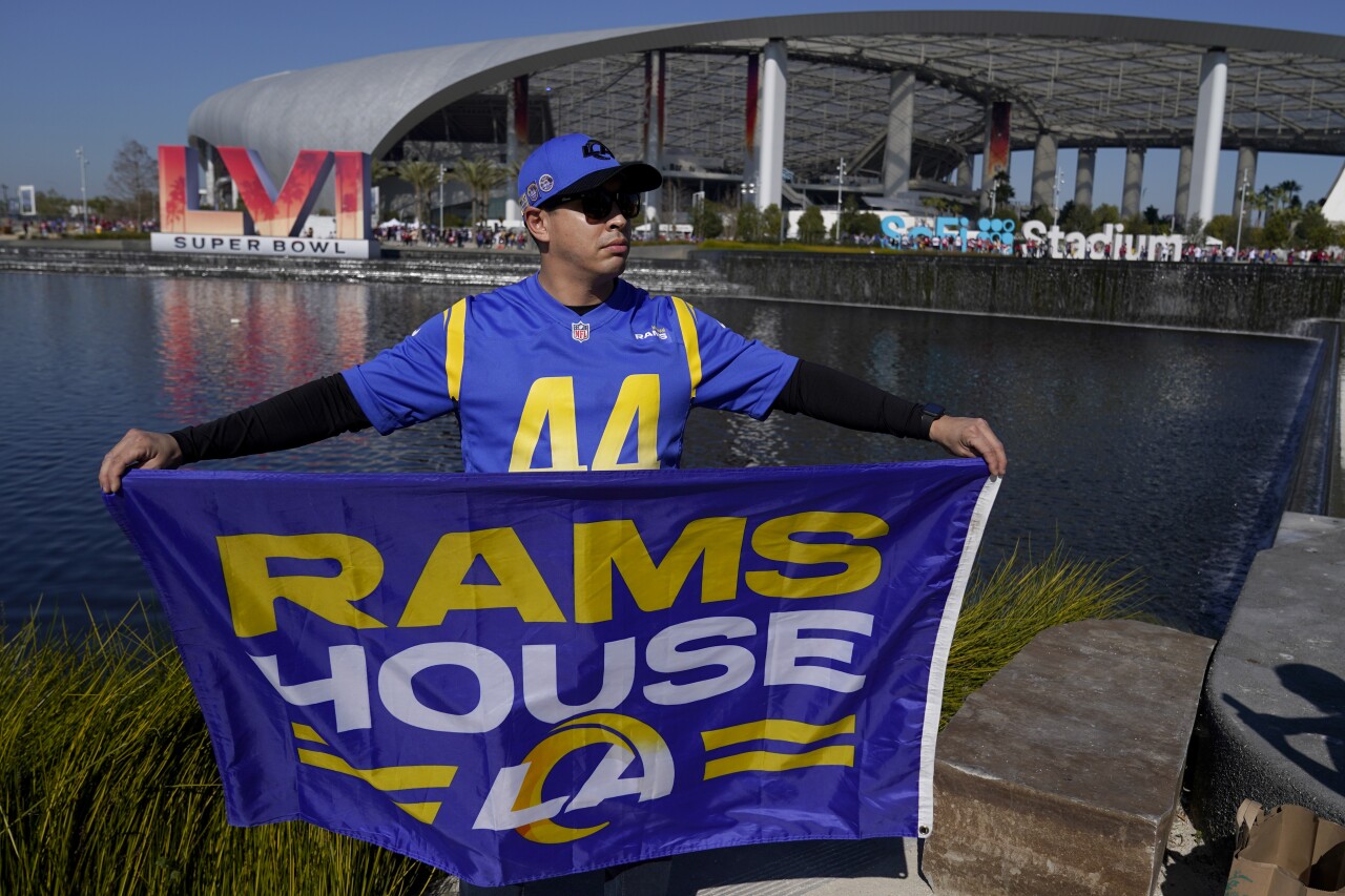 Los Angeles Rams fan holds 'Rams House' flag outside SoFi Stadium, site of Super Bowl LVI, before NFC Championship, Jan. 30, 2022