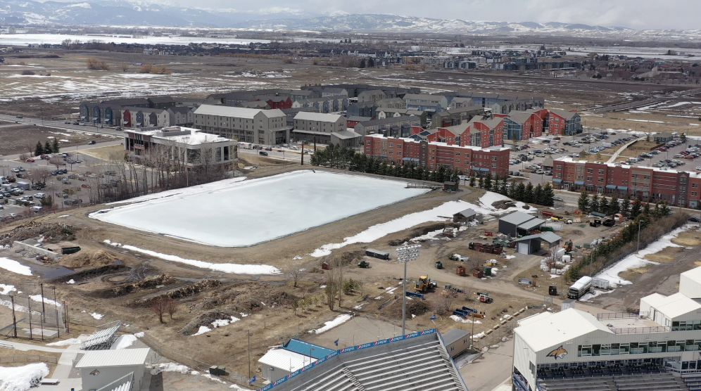 One of the possible locations for Montana State's indoor performance facility is between the university's retention pond and the start of the parking lot for Bobcat Stadium.