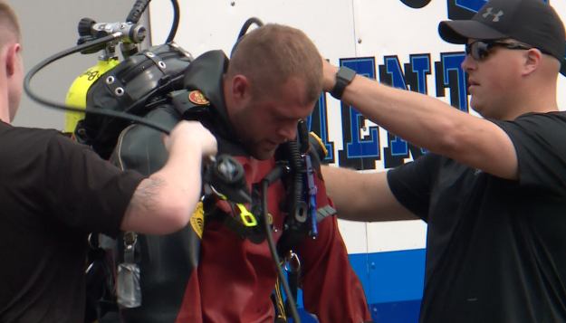 Police officers gearing up for water rescue and recovery training efforts.