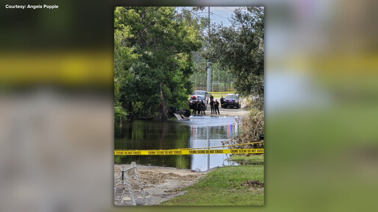 Deputy hospitalized after patrol vehicle overturned into floodwaters