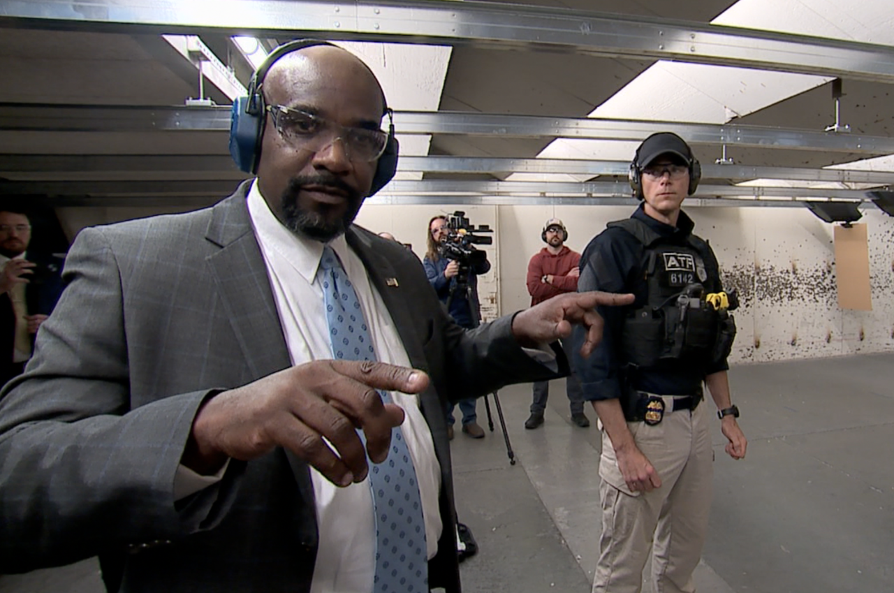 U.S. Attorney Kenneth Parker (left) and ATF Special Agent Nicholas Radebaugh (right) after a demonstration on a gun range