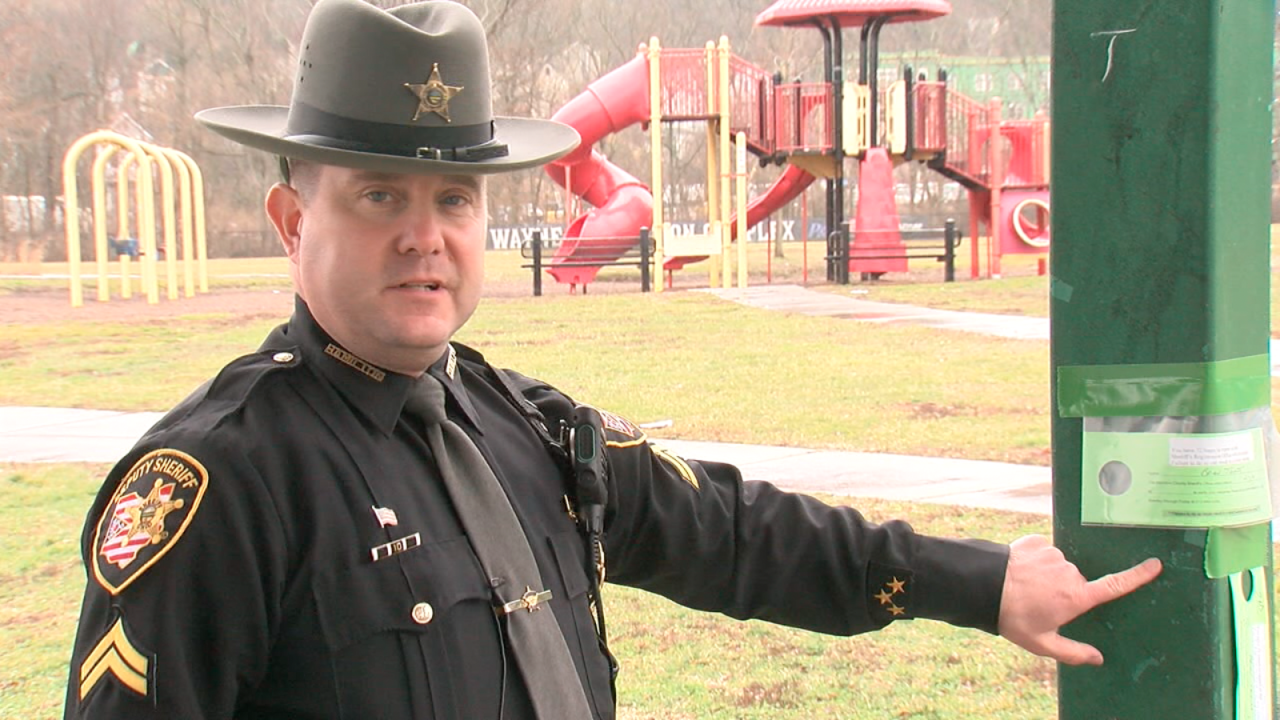 Corporal Ed Shinkle stands under a Cincinnati park shelter listed as the home address for a registered sex offender