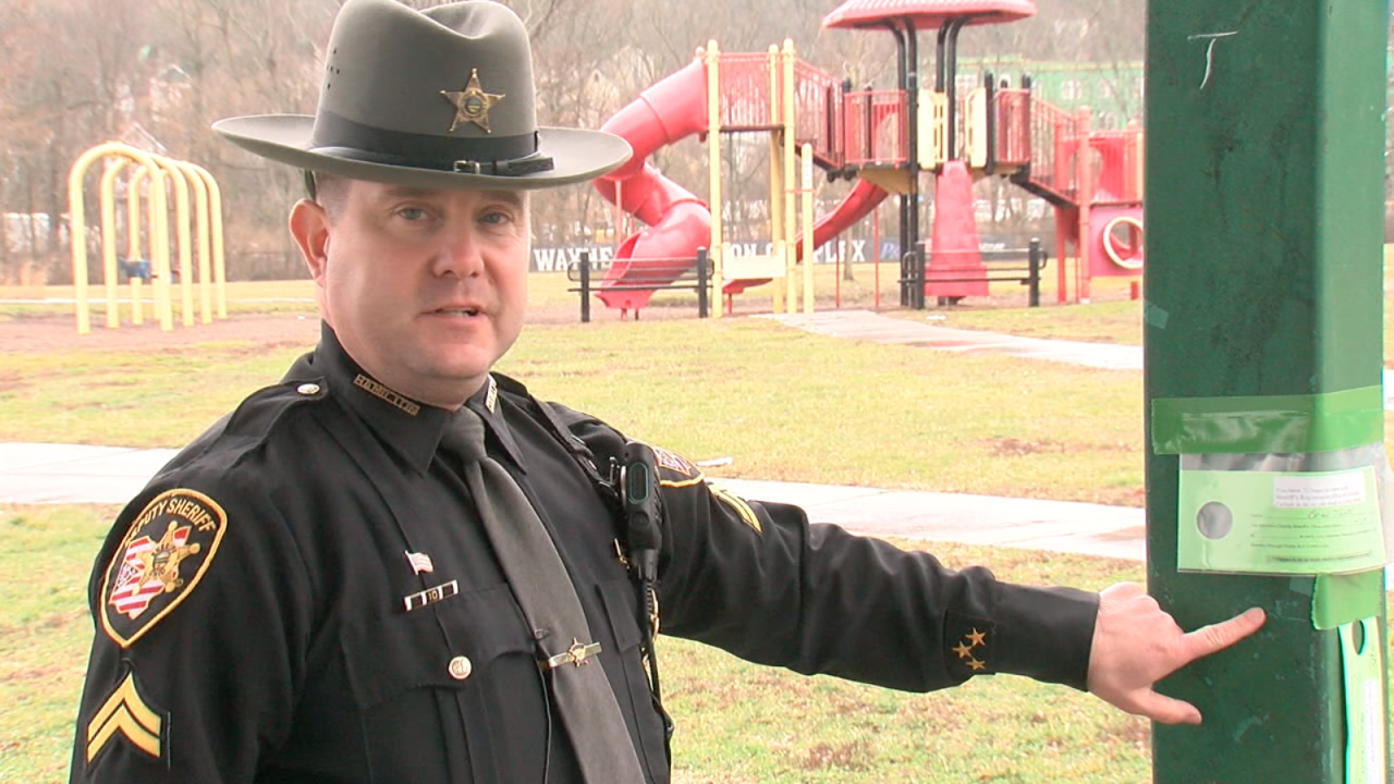 Corporal Ed Shinkle stands under a Cincinnati park shelter listed as the home address for a registered sex offender 