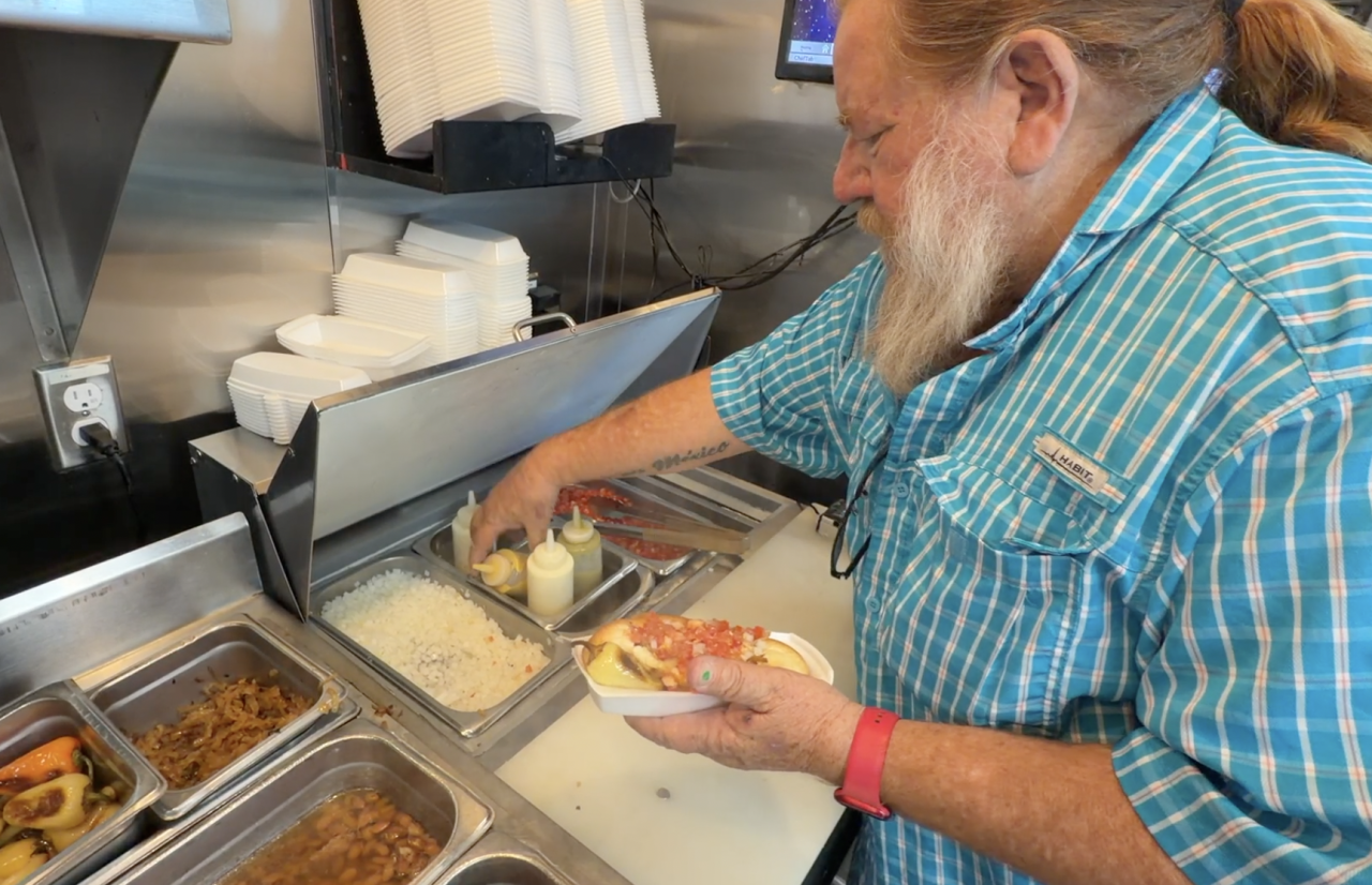 Daniel Contreras making a Sonoran hot dog