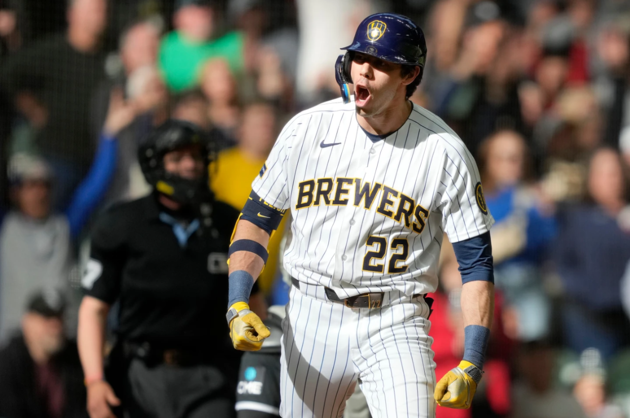 Milwaukee Brewers' Christian Yelich reacts to hitting a three-run home run during the eighth inning of a baseball game against the Chicago White Sox, Sunday, March 29, 2026, in Milwaukee.