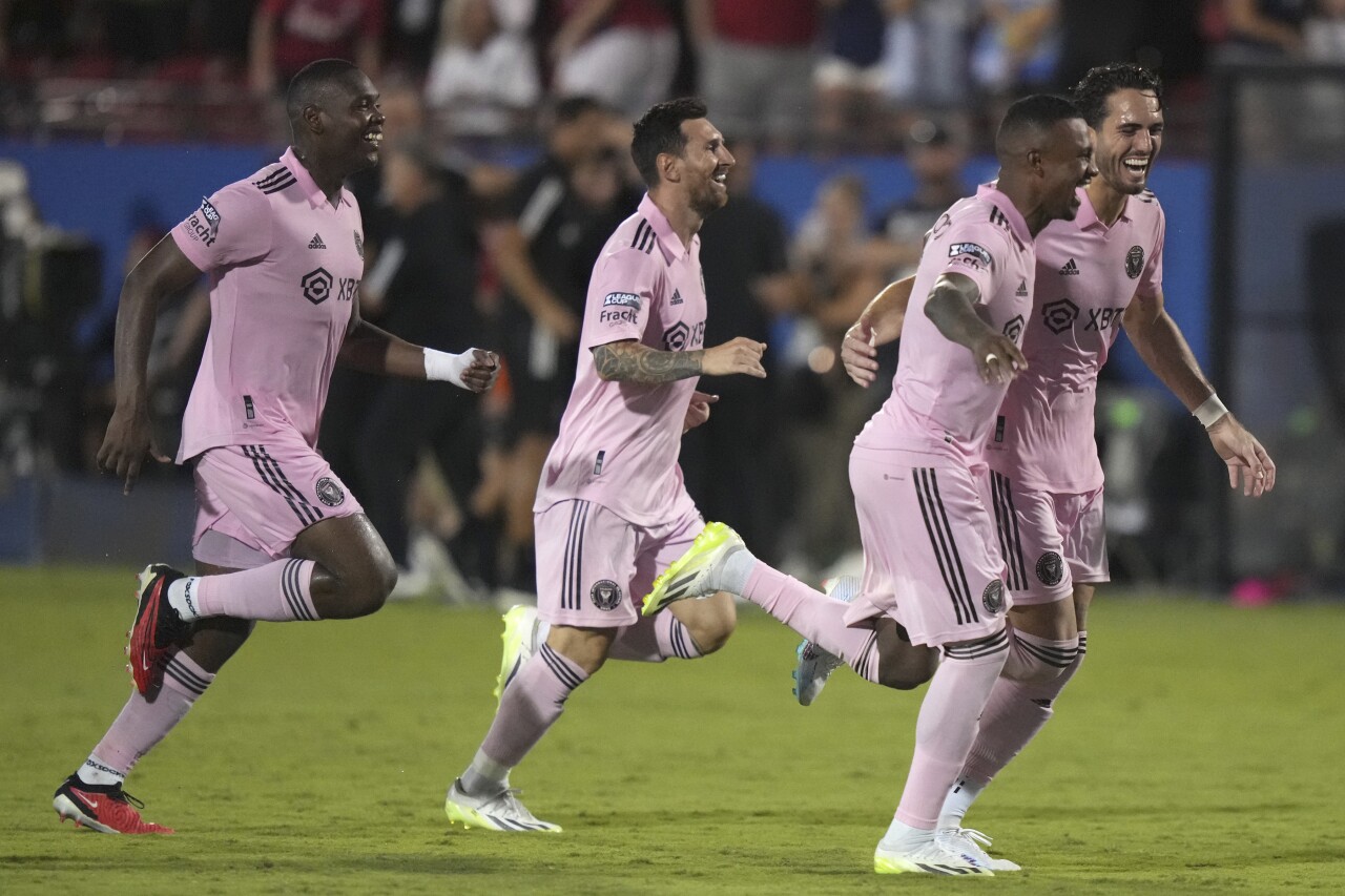 Inter Miami forward Lionel Messi celebrates with teammates after beating FC Dallas, Aug. 6, 2023