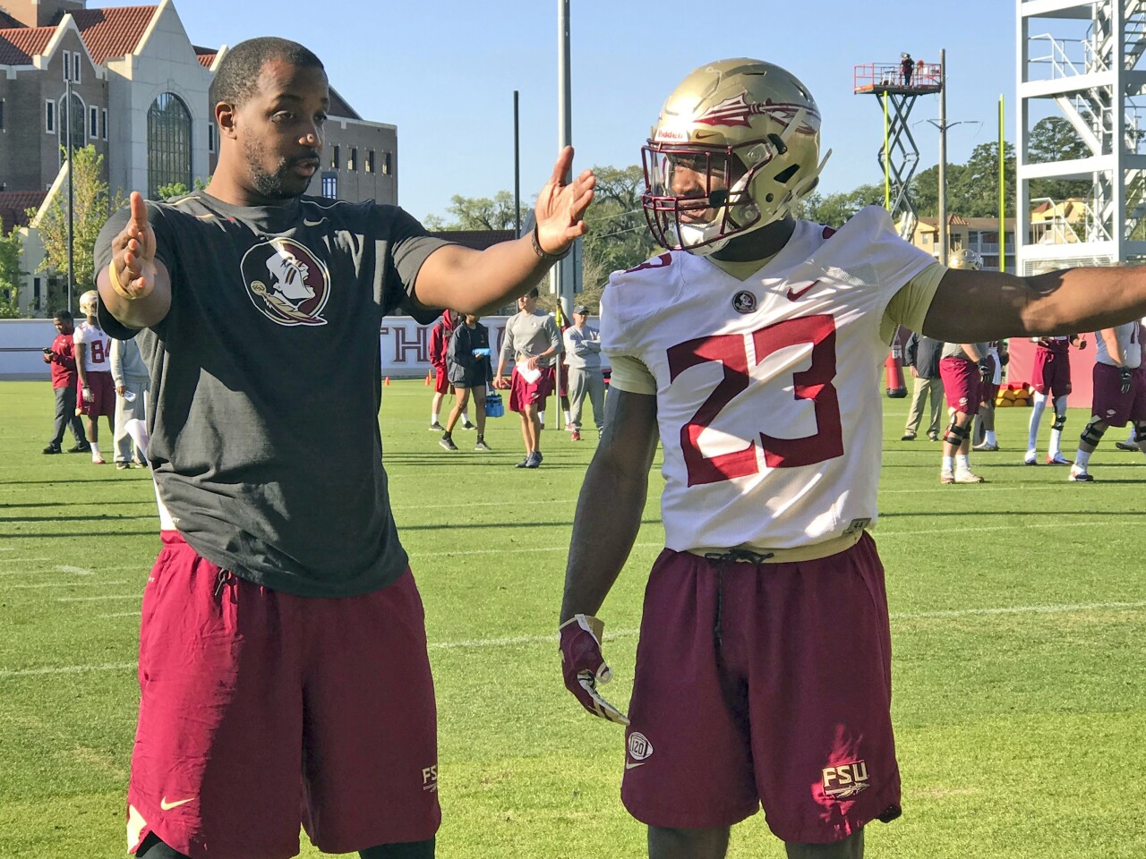 Florida State Seminoles running backs coach Donte' Pimpleton and Cam Akers during 2018 practice