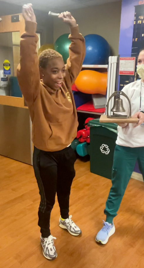 Shelbe ringing the bell after completing her recovery