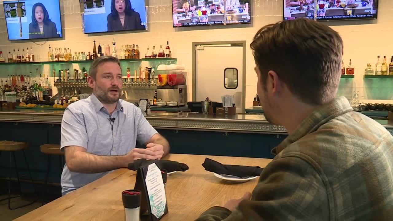 Kevin Grubbs, co-owner of Latitude Seafood Co., and CBS 6 Investigative Reporter Tyler Layne