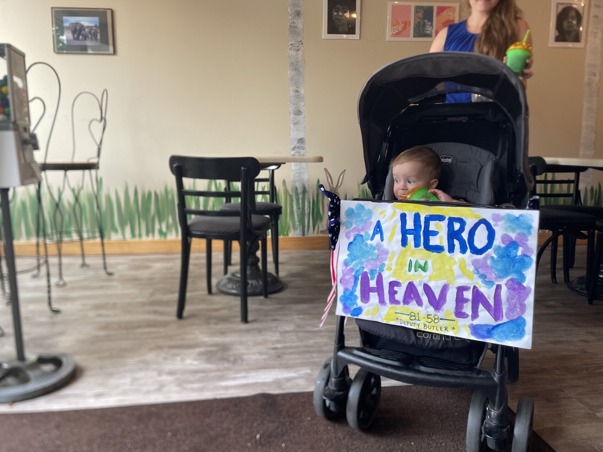 Baby with sign to honor Bulter