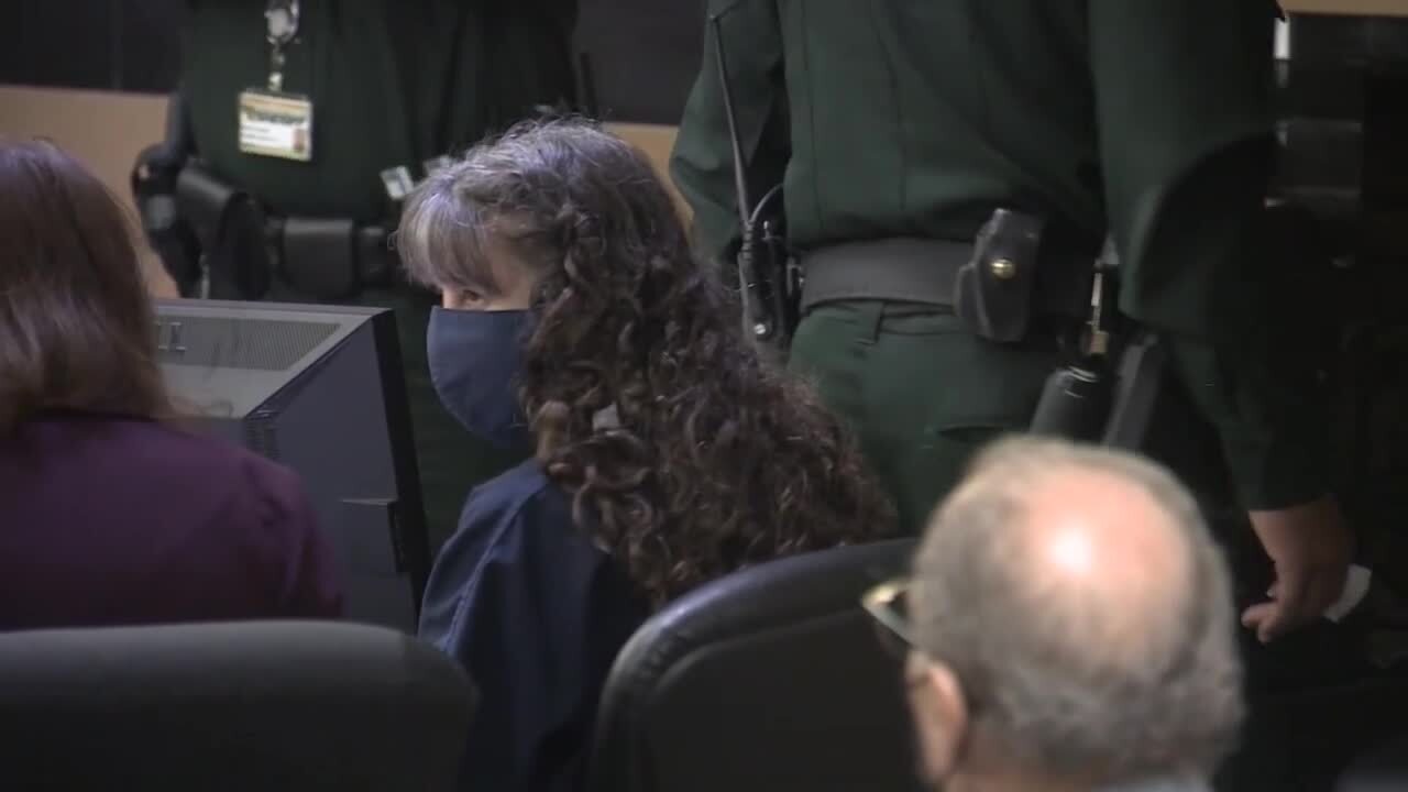 Sheila Keen-Warren speaks to attorney in court during hearing, Oct. 21, 2022