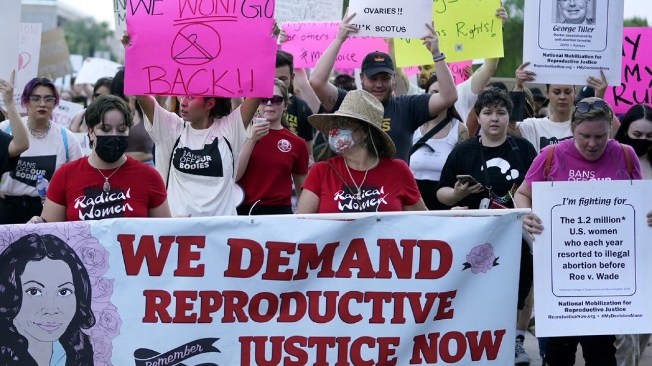 Abortion rights supporters protest outside the Arizona state Capitol.