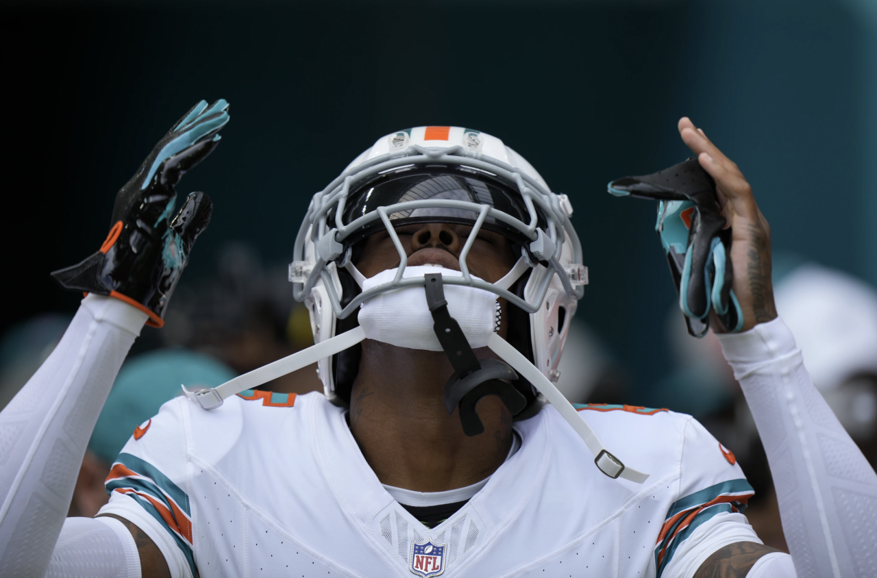 Miami Dolphins cornerback gestures as he makes debut vs. New England Patriots, Oct. 29, 2023