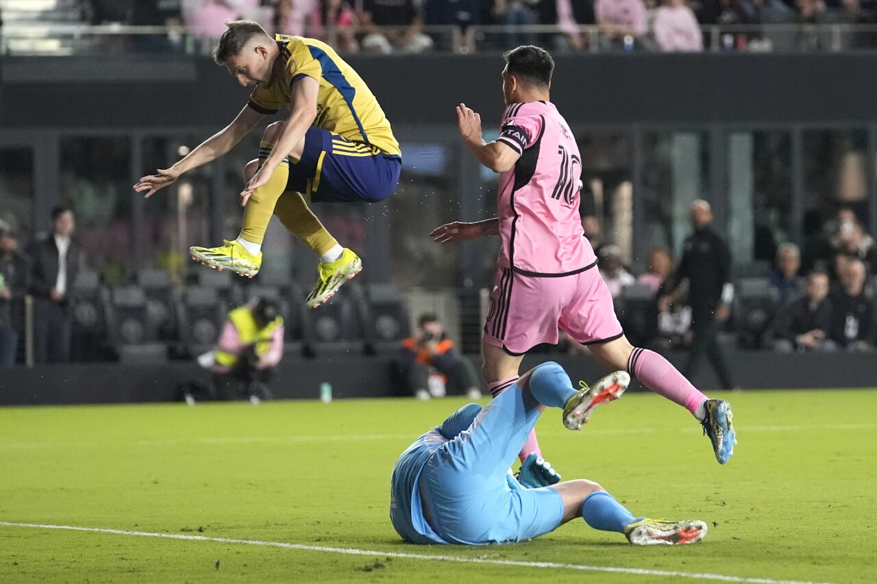 Real Salt Lake defender Andrew Brody leaps as Real Salt Lake goalkeeper Zac MacMath makes save on shot by Inter Miami forward Lionel Messi, Feb. 21, 2024