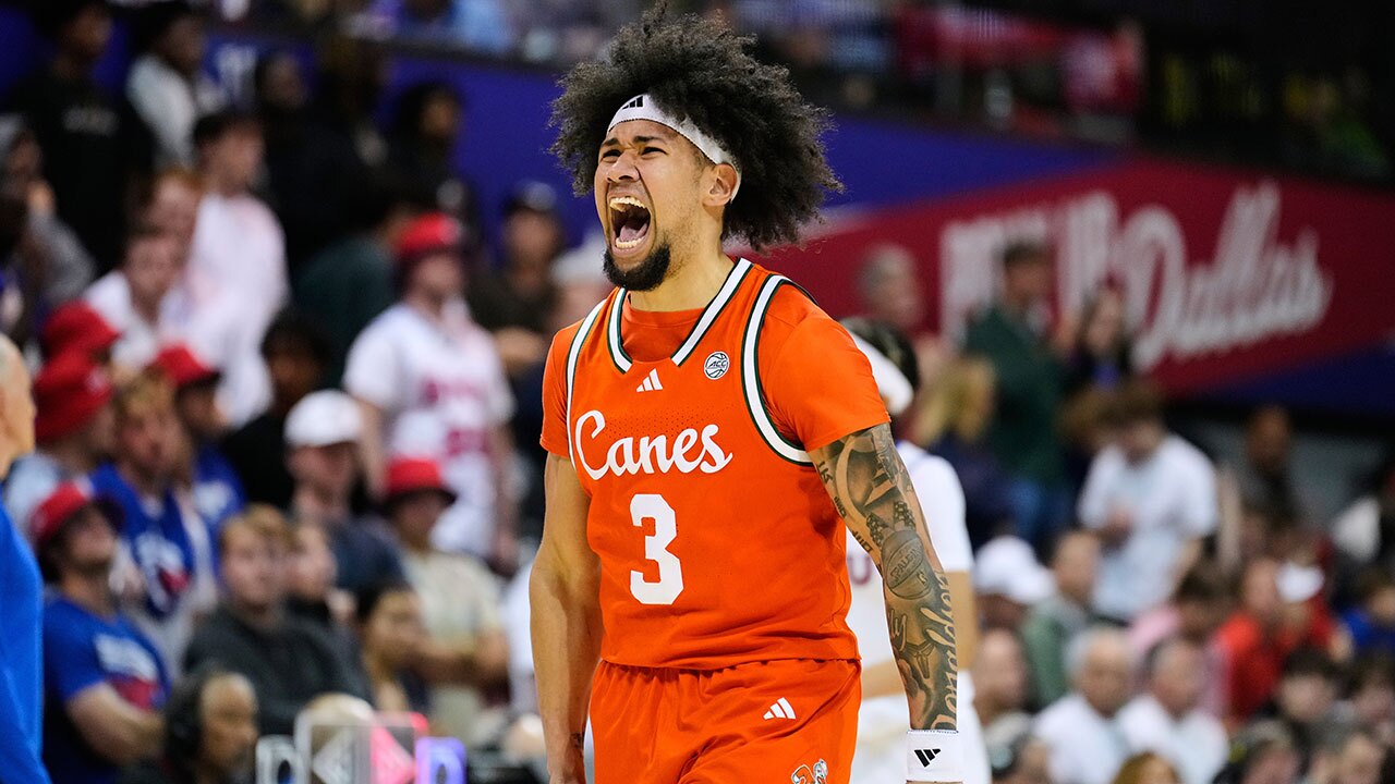 Miami guard Tre Donaldson celebrates after sinking a three-pointer in the second half of an NCAA college basketball game against SMU in Dallas, Wednesday, March 4, 2026.