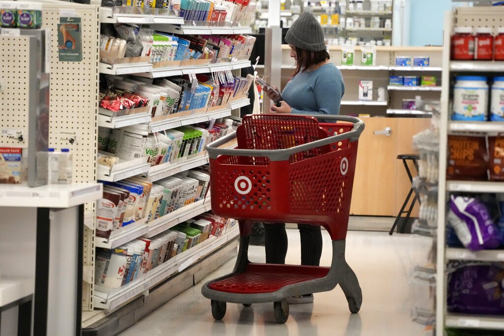 A shopper checks out an item in a Target store in Pittsburgh.