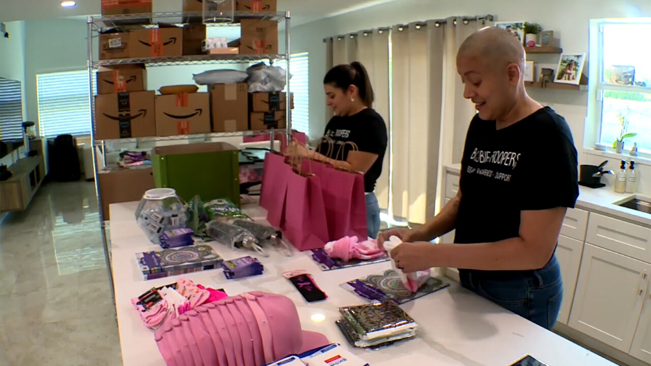 Mariela Contreras and her sister Deniz Ozaltin prepare care packages