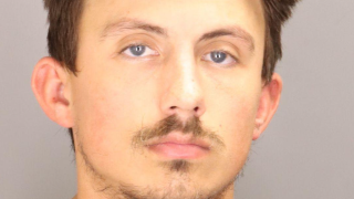 Abela mugshot.png