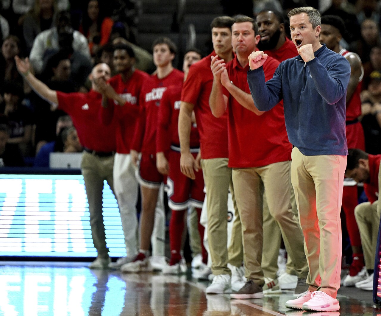 FAU Owls head coach Dusty May stands with team on sideline after play at Florida Gulf Coast Eagles, Dec. 30, 2023