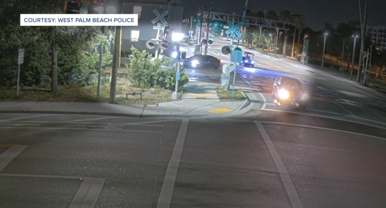 Surveillance image of car driving on to train tracks in West Palm Beach May 2024 .png