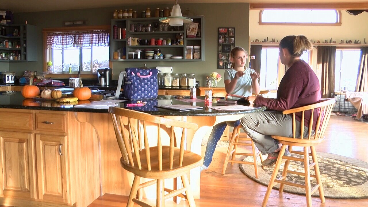 Sheila Duncan works with her daughter Josie, after school