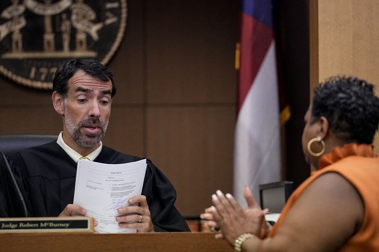 Georgia Election Investigation County Clerk Che Alexander (right) speaks with Fulton County Superior Court Judge Robert McBurney, Monday, Aug. 14, 2023, in Atlanta. (AP Photo/Brynn Anderson)