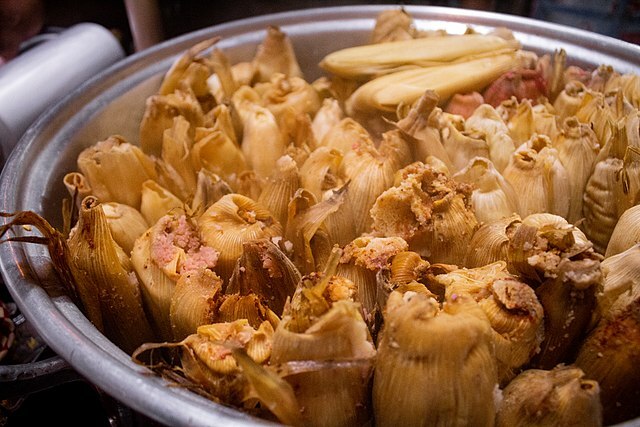 Large pot of steaming, fresh-made tamales