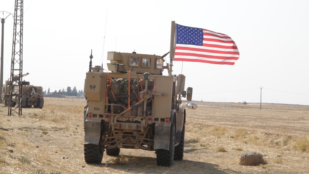 US military vehicles driving inside Syria