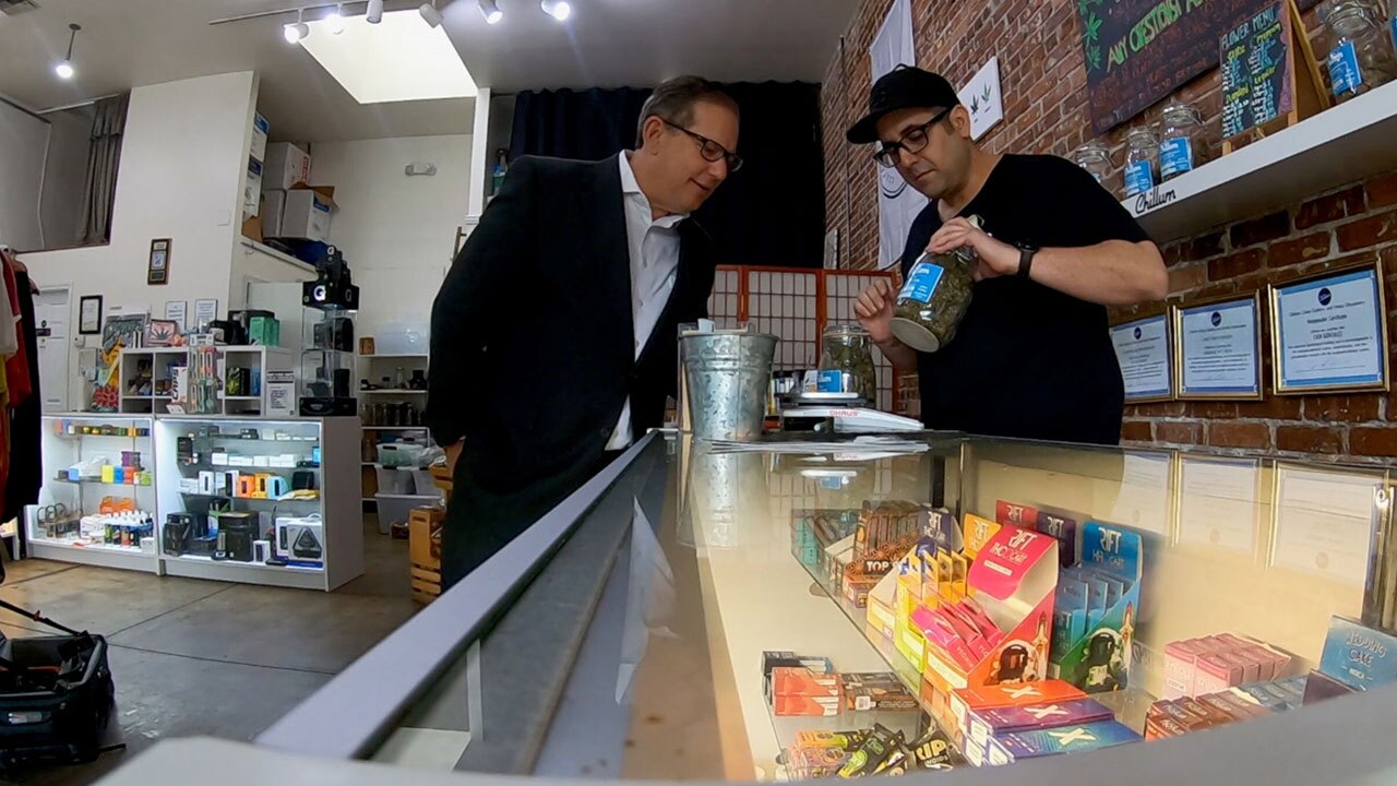 Carlos-Hermida-sells-CBD-products-to-smoke-and-eat-at-his-hemp-dispensary-in-Ybor-City-WFTS.jpg
