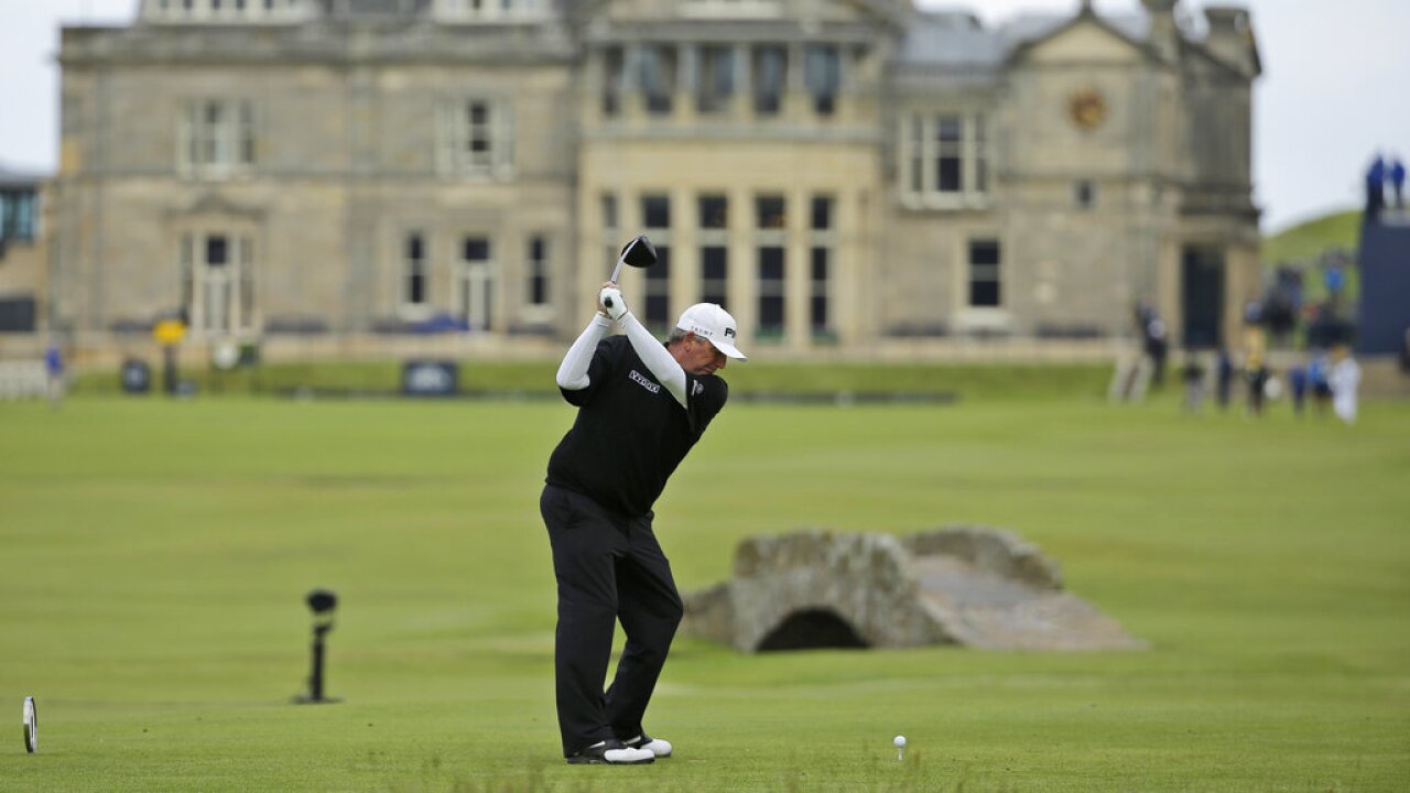 Mark Calcavecchia plays from the 18th tee during the first round of the British Open Golf Championship at the Old Course, St. Andrews, Scotland, Thursday, July 16, 2015. 