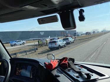 A viewer photo of crews surrounding the aircraft after the emergency landing. Courtesy Tiffaney Anderson.