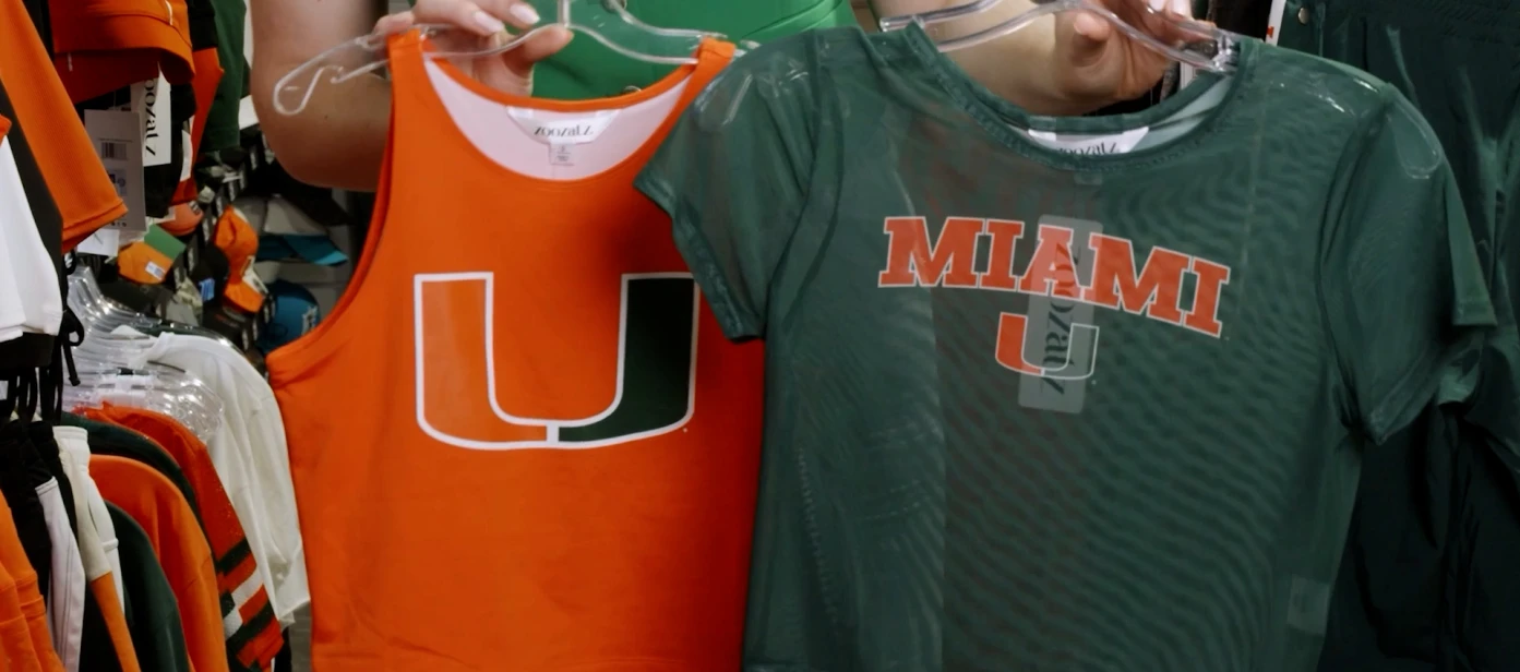 Elevate your game day look with Zoozatz tops, now available at Caneswear